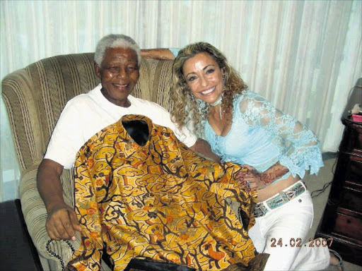 Nelson Mandela approves Whites to make his official African clothes. 
